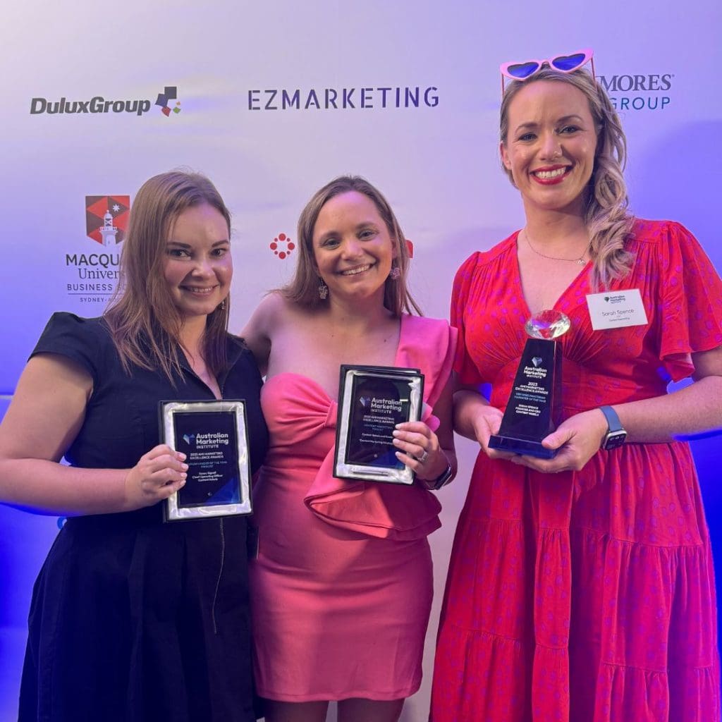 Image of Sarah Spence and her team with trophies