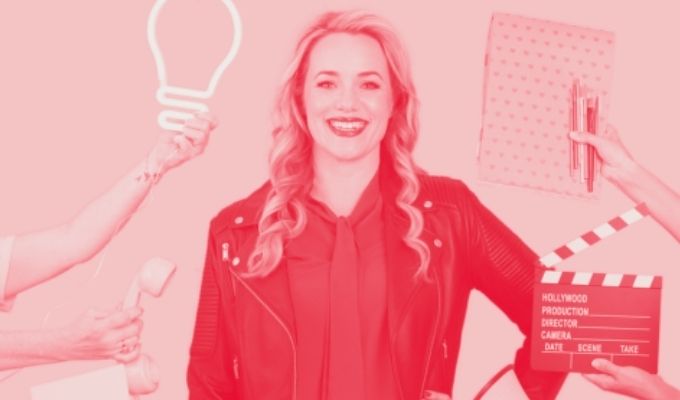 picture of Sarah Spence surrounded by content marketing props