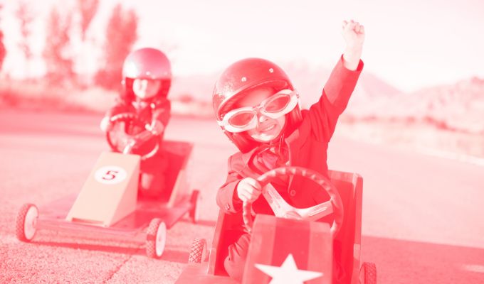 image of two kids in gocarts to demonstrate google traffic